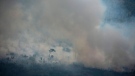 A pall of smoke covers an area of Altamira, Para state, Brazil, Saturday, Aug. 24, 2019. (AP Photo/Leo Correa)