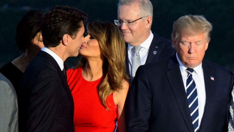 Prime Minister Justin Trudeau greets Melania Trump as she arrives for a family photo with husband U.S. President Donald Trump during the G7 Summit in Biarritz, France on Sunday, Aug. 25, 2019. THE CANADIAN PRESS/Sean Kilpatrick