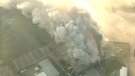 Smoke billows from a furniture plant in Ancaster, Ont. as seen from the CTV News helicopter over the scene, Tuesday morning, Aug. 25, 2009.