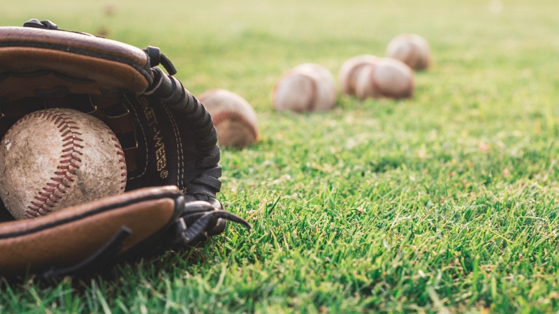 Baseballs and a baseball glove can be seen in this undated image. (Steshka Willems/ Pexels)