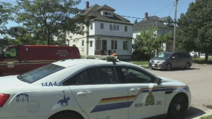 Police execute a search warrant at a home in Moncton on Aug. 28, 2019.