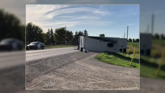 camper trailer flipped Dorking crash