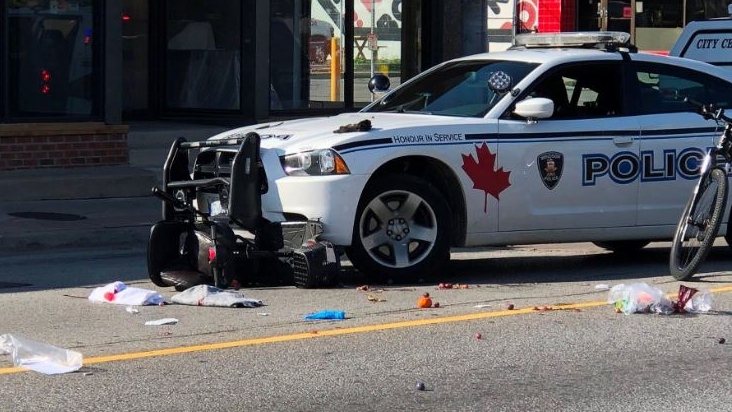 The aftermath of a collision involving a Windsor Police Service cruiser and a pedestrian on a motorized scooter in the intersection of Wyandotte St. E. and McDougall St. on Monday September 2, 2019. (Photo by AM800's Gord Bacon)
