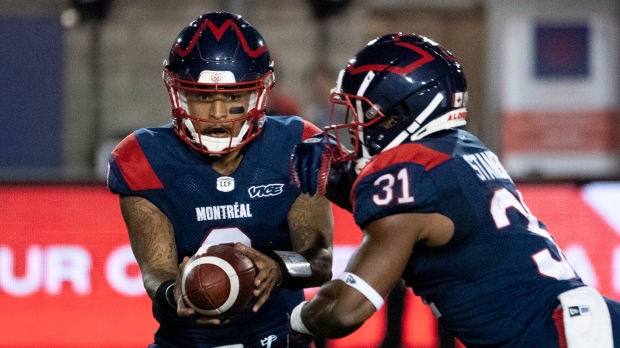 Montreal Alouettes quarterback Vernon Adams Jr. hands off to Montreal Alouettes running back William Stanback during first quarter CFL football action against the BC Lions in Montreal on Friday, September 6, 2019. THE CANADIAN PRESS/Paul Chiasson