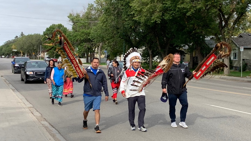 Walkers trek from the Regina Indian Industrial School Cemetery, to help transport the spirits of the children that lost their lives at the school. (Colton Wiens/CTV News)
