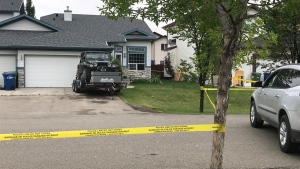 Police tape blocks off a home at the centre of an investigation into a shooting in the City of Airdrie on September 7, 2019.