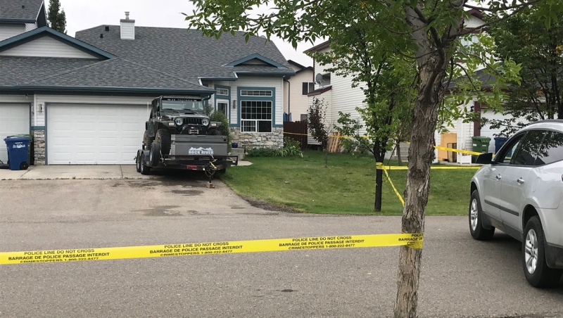Police tape blocks off a home at the centre of an investigation into a shooting in the City of Airdrie on September 7, 2019.