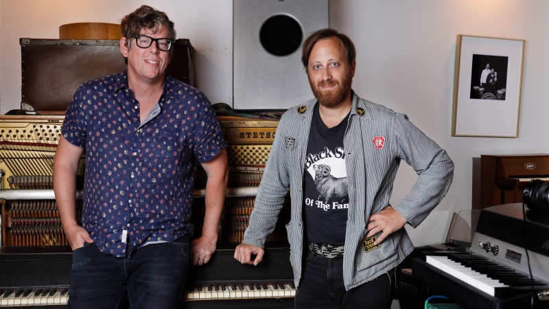 In this Aug. 19, 2019, photo, Patrick Carney, left, and Dan Auerbach of The Black Keys pose for a portrait in Nashville, Tenn. The Grammy-winning duo back with their ninth record called “Let’s Rock,” and a new tour starting Sept. 19 in Los Angeles. (AP Photo/Mark Humphrey)