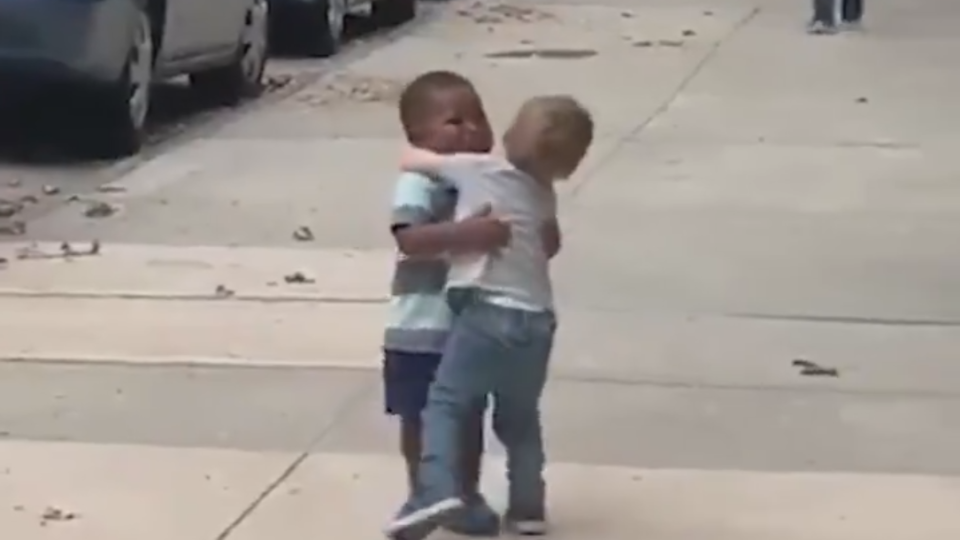 Toddlers hugging