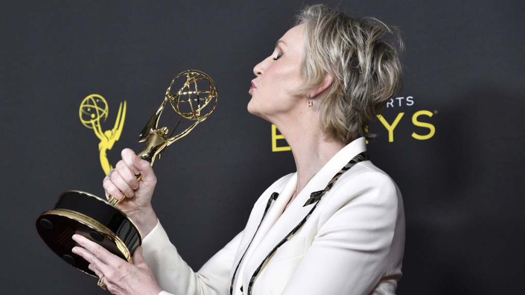 Jane Lynch poses with her Emmy