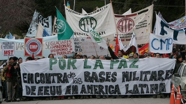 People demonstrate against Colombia's plan to give U.S. troops greater access to its military bases during a protest in San Carlos de Bariloche, some 1,500 kilometres southwest of Buenos Aires, Thursday, Aug. 27, 2009. (AP / Eduardo Di Baia)