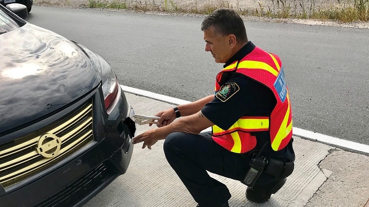 MTO conducting roadside vehicle fitness inspection