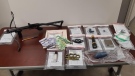 Drugs, weapons and cash are seen following a search on Wednesday, Sept. 18, 2019. (Source: Sarnia Police Service)