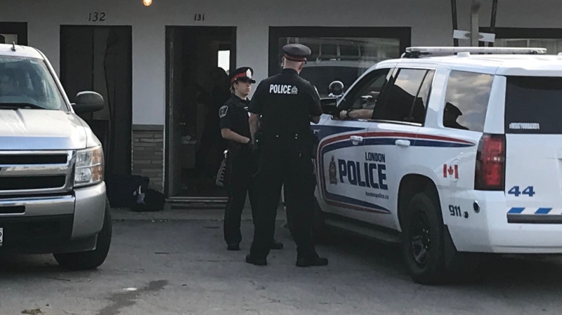 Police investigate a reported assault at the Casa Blanca Motel in London, Ont. on Friday, Sept. 20, 2019. 