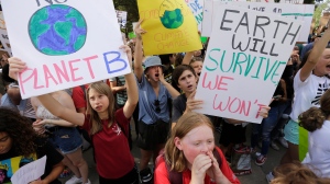 Students chant as they gather for a climate strike rally at the Texas capitol, Friday, Sept. 20, 2019, in Austin, Texas. A wave of climate change protests swept across the globe Friday, with hundreds of thousands of young people sending a message to leaders headed for a U.N. summit. (AP Photo/Eric Gay)