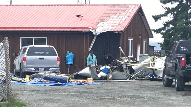 Transportation Safety Board investigators comb through the wreckage of the down helicopter in Campbell River. (Andy Garland/CTV Vancouver Island)