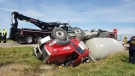 An overturned cement truck is seen after a crash in Warwick Township, Ont. on Wednesday, Sept. 25, 2019. (Source: Lambton County OPP)