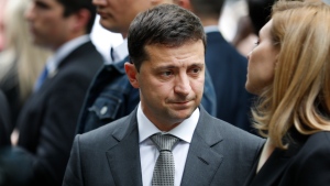 Ukraine President Volodymyr Zelensky visits the site of the 9/11 terror attacks at ground zero in New York, Thursday, Sept. 26, 2019. Zelensky made specific stops at the names of victims that were born in Ukraine. (AP Photo/Seth Wenig)
