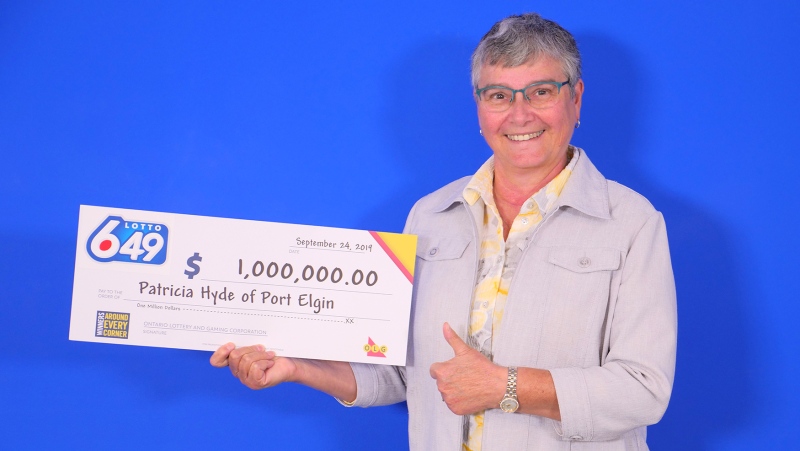 Patricia Hyde picks up her million-dollar cheque in Toronto on Friday, Sept. 27, 2019. (Source: OLG)