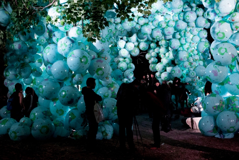 People walk through the 'Walk among Worlds' installation during the 2014 Scotiabank Nuit Blanche in Toronto. (Hannah Yoon/The Canadian Press)