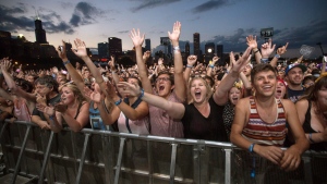 Concertgoers at the Lollapalooza Festival in Chicago, on Aug. 3, 2013. (Scott Eisen / THE CANADIAN PRESS / AP)