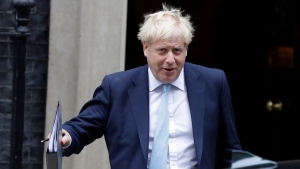 In this file photo, Britain's Prime Minister Boris Johnson leaves Downing Street to attend Parliament in London, Thursday, Oct. 3, 2019. (AP Photo/Kirsty Wigglesworth)