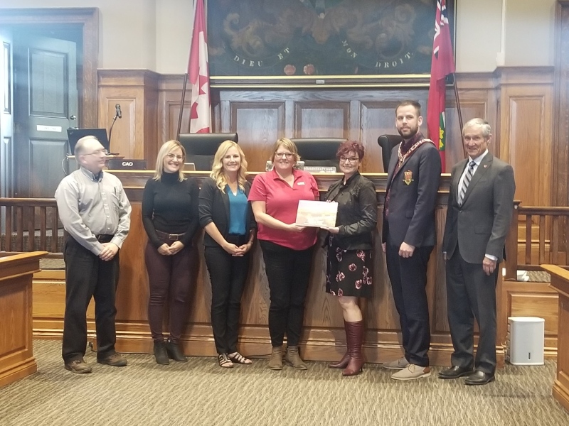 Middlesex County presented the 2019 Marketing Canada Award for the Fields to Forks video campaign to local partners. On hand to accept the award are, left to right, Thomas Green, Tania Dejonge, Cara Finn, Joanne Fuller, Sherry Flick , Warden Kurtis Smith and Crispin Coluin. 
