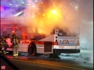 Flames and heavy smoke were seen shooting out of a bus on Yonge Street on Sept. 2, 2009. 