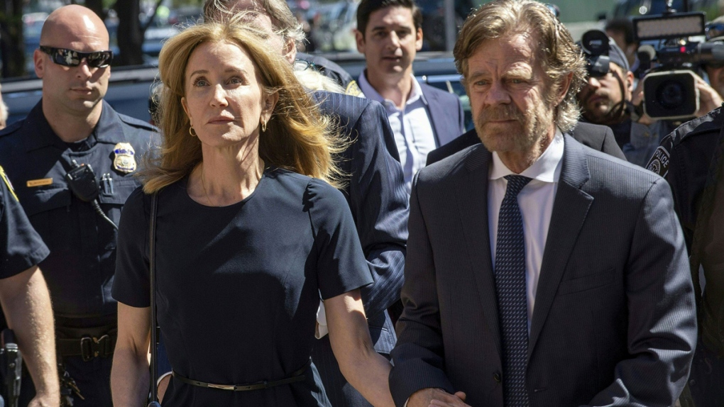 Felicity Huffman reports to federal prison