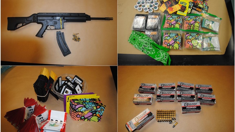Investigators found a loaded .22 calibre assault rifle, nine boxes of ammunition, 359 packages of cannabis shatter, one ounce of pre-packaged soft cocaine, and more than $4,200 in cash in 22nd Street motel, police say. (Saskatoon Police Service.)