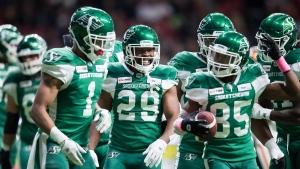 Saskatchewan Roughriders' William Powell (29), Shaq Evans (1) and Kyran Moore (85) celebrate Powell's touchdown against the B.C. Lions during the first half of a CFL football game in Vancouver, on Friday October 18, 2019. THE CANADIAN PRESS/Darryl Dyck