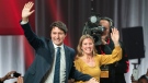 Liberal Leader Justin Trudeau and wife Sophie Gregoire Trudeau wave as they go on stage at Liberal election headquarters in Montreal, Monday, Oct. 21, 2019. (THE CANADIAN PRESS/Paul Chiasson)