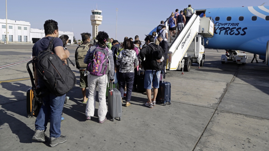 Passengers board an Egyptair Express plane