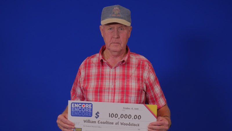 William Esselstine, of Woodstock, holds a cheque for $100,000. (Source: OLG)