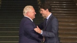 Ontario Premier Doug Ford greets Canadian Prime Minister Justin Trudeau at the Ontario Legislature, in Toronto on Thursday July 5, 2018. THE CANADIAN PRESS/Chris Young