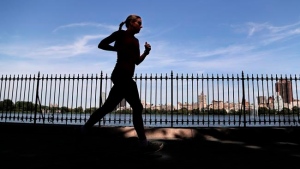 A woman jogs through Central Park in New York on Aug. 9, 2016. THE CANADIAN PRESS/AP, Julie Jacobson