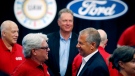 FILE - In this Monday, July 15, 2019, file photo, United Auto Workers Local 600 President Bernie Ricke, left, talks with Ford Motor Co., President Automotive Joseph R. Hinrichs after opening contract talks in Dearborn, Mich. (AP Photo/Carlos Osorio, File)