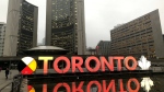 The Toronto sign is seen lit up in orange for Halloween on Oct. 31, 2019 outside of city hall. (Twitter / @JohnTory)