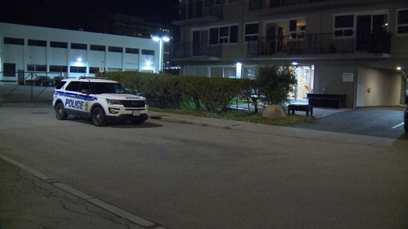 A police vehicle sits outside an apartment building on Sidney St. where a man was found dead on Friday night. (Shaun Vardon/CTV Ottawa, November 1, 2019) 