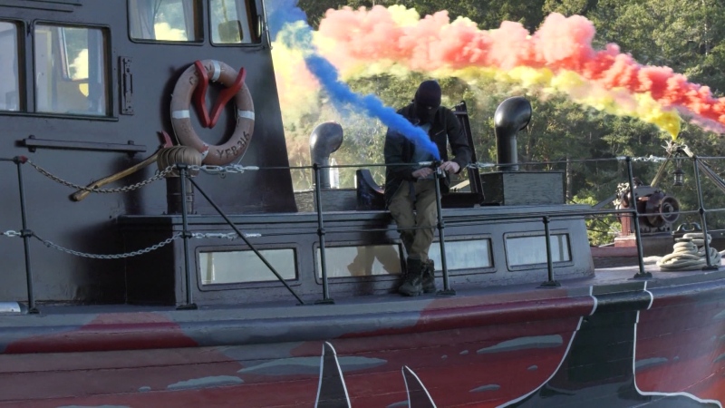 Aboard Seaquarium's Shame, White sets off colourful smoke bombs that are intended to obscure whale watchers' views of the whales and create a floating work of art. (CTV)