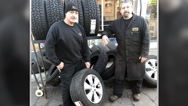 Albert Saikaley and Nick Dirienzo busy with snow tire changes