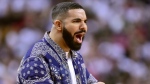 Rapper Aubrey 'Drake' Graham reacts from courtside during the second half of Game 1 of a second-round NBA basketball playoff series between the Toronto Raptors and the Philadelphia 76ers in Toronto, Saturday, April 27, 2019. Frank Gunn/The Canadian Press via AP