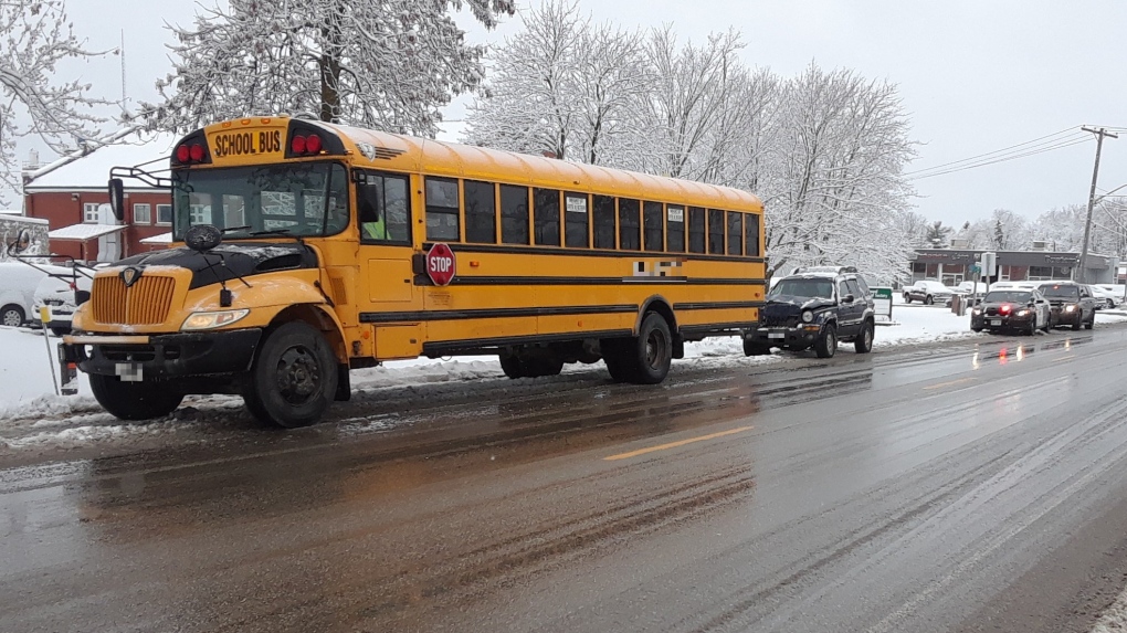 A school bus and an SUV after a crash