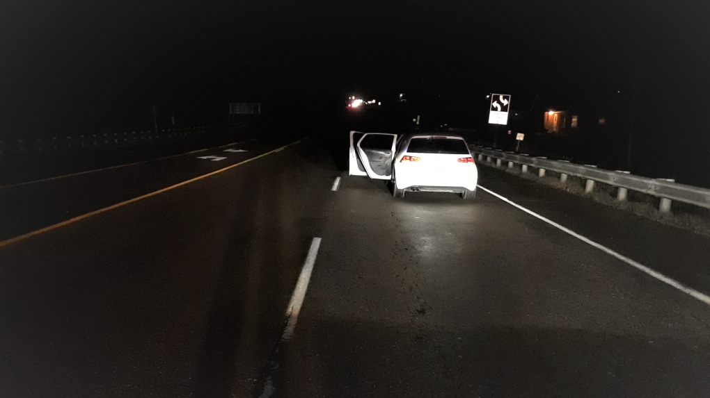 Car parked in a live lane of Highway 10, Caledon