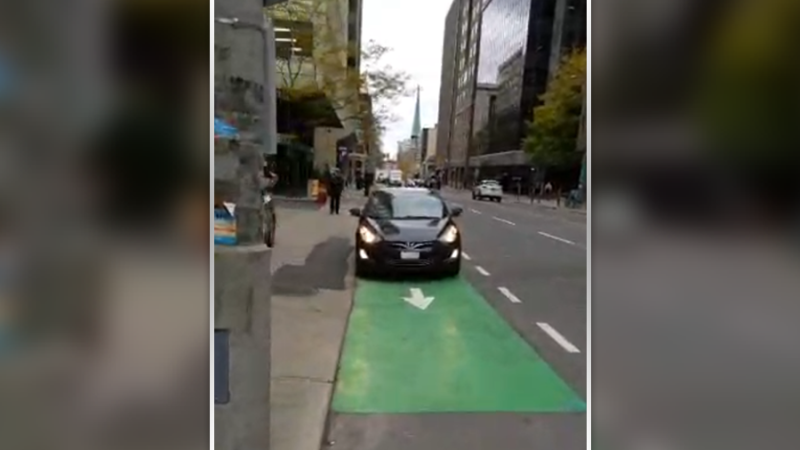In response to a car blocking a Laurier bike lane, Ottawa cyclist Kevin O’Donnell stages a unique one man protest and posts the video on social media on Wednesday, Nov. 6, 2019. (@kevindotnet/Twitter )