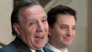 Quebec Premier Francois Legault speaks during a end of session wrap up news conference, Friday, June 14, 2019 at his office in Quebec City. Quebec government House Leader and Minister of Immigration, Diversity and Inclusiveness Simon Jolin-Barrette, right, looks on. THE CANADIAN PRESS/Jacques Boissinot