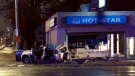 A vehicle is left heavily damaged after crashing into a building in the city's west end. (AM800 / Gord Bacon) 