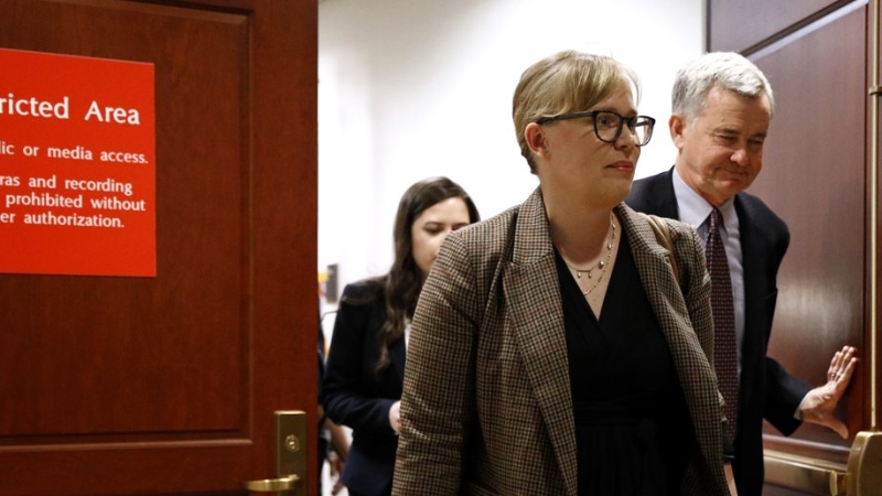 Catherine Croft, a State Department adviser on Ukraine, departs a secure area of the Capitol after a closed door meeting where she testified as part of the House impeachment inquiry into U.S. President Donald Trump, Wednesday, Oct. 30, 2019, on Capitol Hill in Washington. (AP Photo/Patrick Semansky)