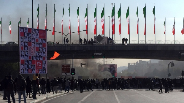 Protests grip major Iran cities over gas prices; 1 killed