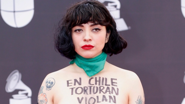 Chilean singer Mon Laferte goes topless at Latin Grammys in support of protests